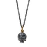 A YELLOW AND SILVER SKULL PENDANT, SET WITH ROSE CUT DIAMONDS.