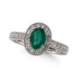 AN EMERALD AND DIAMOND CLUSTER RING, IN PLATINUM MOUNT.