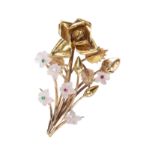 A CARVED QUARTZ, RUBY, EMERALD AND DIAMOND FLOWER BROOCH, IN YELLOW GOLD.