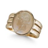 A CARVED CARNELIAN RING, IN YELLOW GOLD.