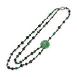 A JADE AND BLACK JET NECKLACE.