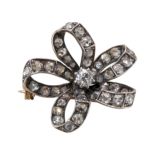 AN ANTIQUE VICTORIAN DIAMOND BOW BROOCH, IN GOLD AND SILVER.