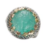 A CARVED CABOCHON EMERALD RING, IN WHITE GOLD.