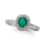 AN EMERALD AND DIAMOND CLUSTER RING, IN PLATINUM.