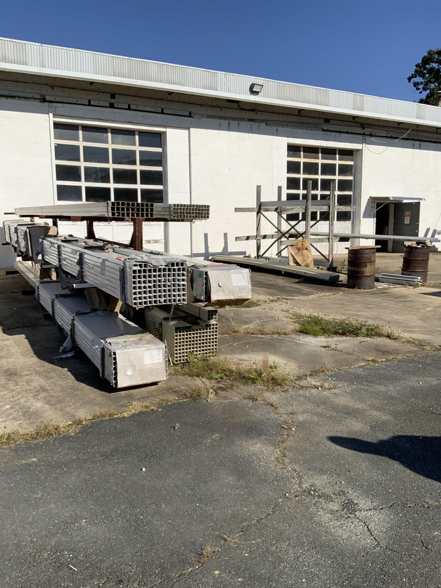 Large Lot of Extruded Aluminum Stock. One Bundle Labeled 585 lbs +/-, One Marked 325 lbs +/-