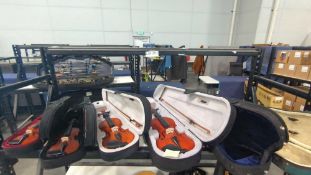 4 violins in cases & 2 cases