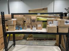 Rolling rack: Boxes of Heyday ear pods, Heyday Charging cables, & GE indoor smart cameras