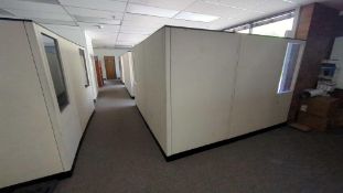 All of the cubicle walls beige color with windows