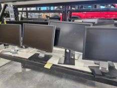 bottom rack approximately 8 delll monitors with stands