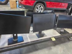 bottom rack approximately 8 delll monitors with stands
