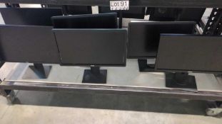 Six Dell monitors on stand