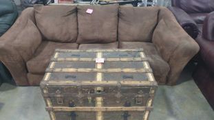 brown couch and treasure chest