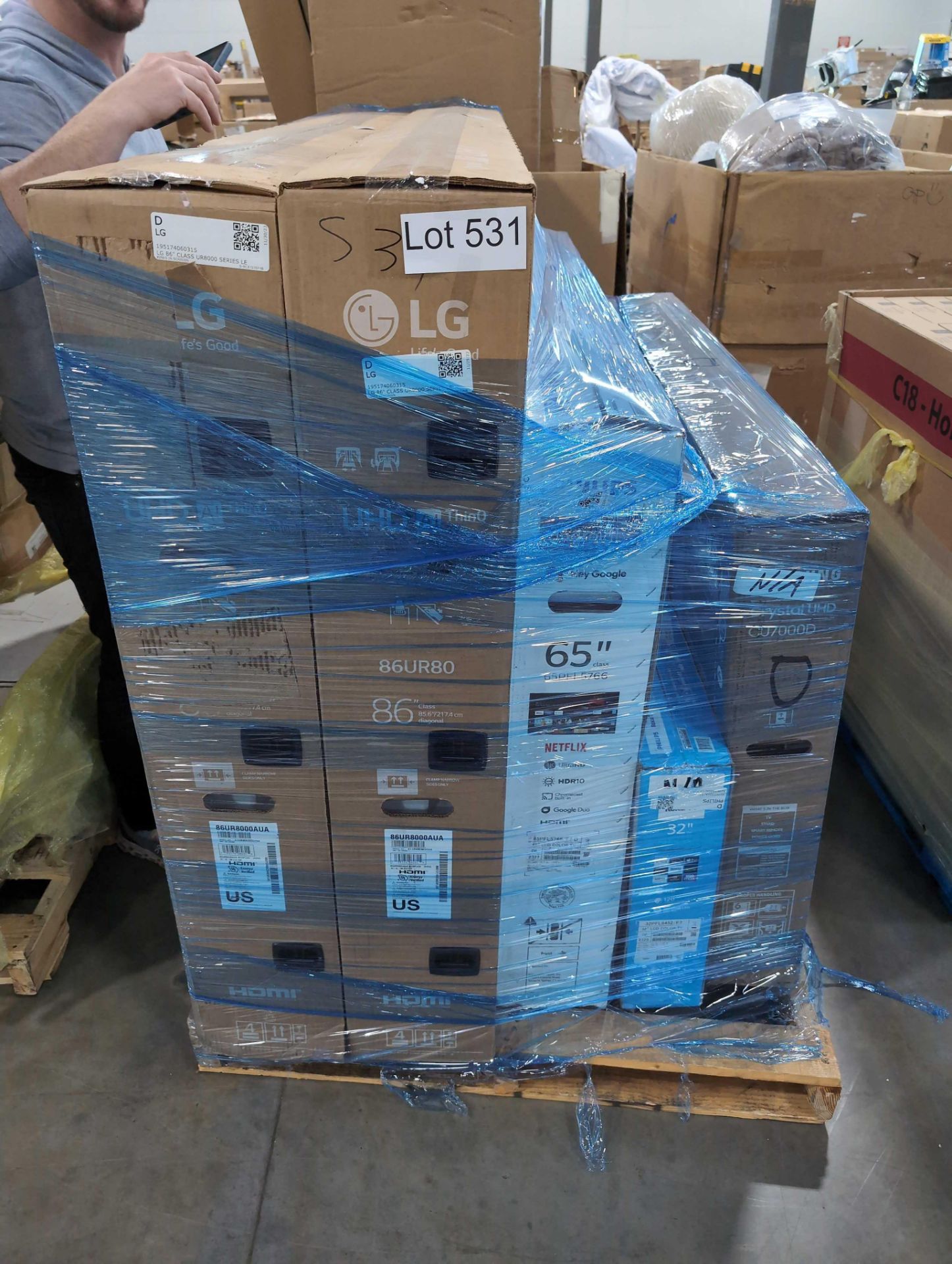 pallet of TVs degrade means working but cosmetic damage to LG 86 in 65-in 32 inch and Samsung 55-in