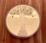 Jumbo "Statue of Liberty Anniversary", 24k gold-layered coin inlaid with 13 sparkling red, white, an