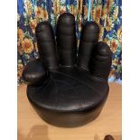 Leather Hand Shaped swivel Chair.