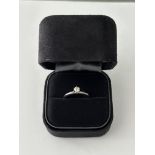 A Tiffany & Co. solitaire diamond ring in a six-cl