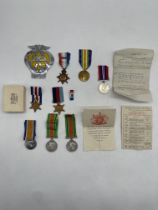 Collection of WW1 and WW2 Medals along with AA Bad