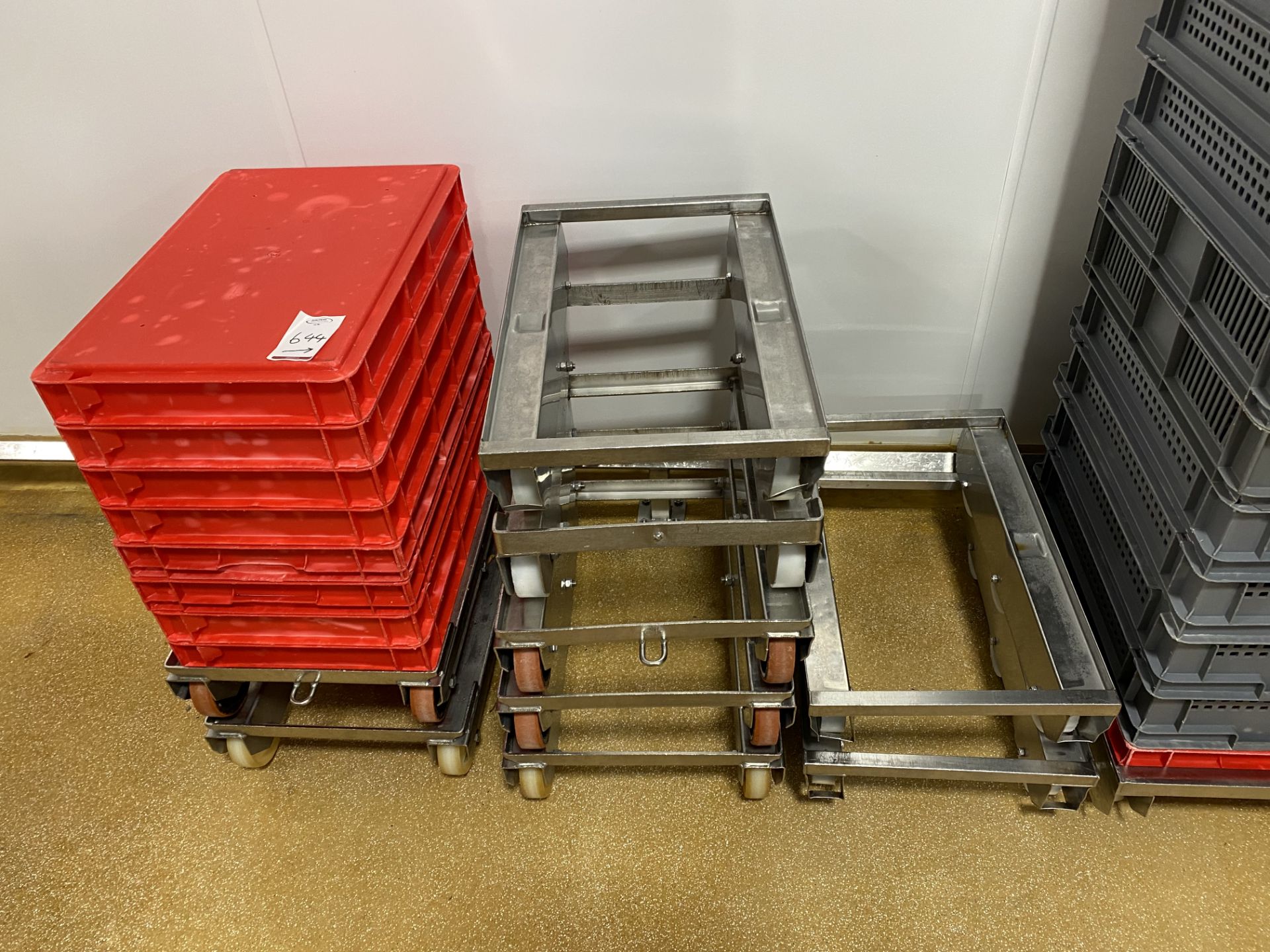 Approximately 90 grey plastic trays with 27 stainl