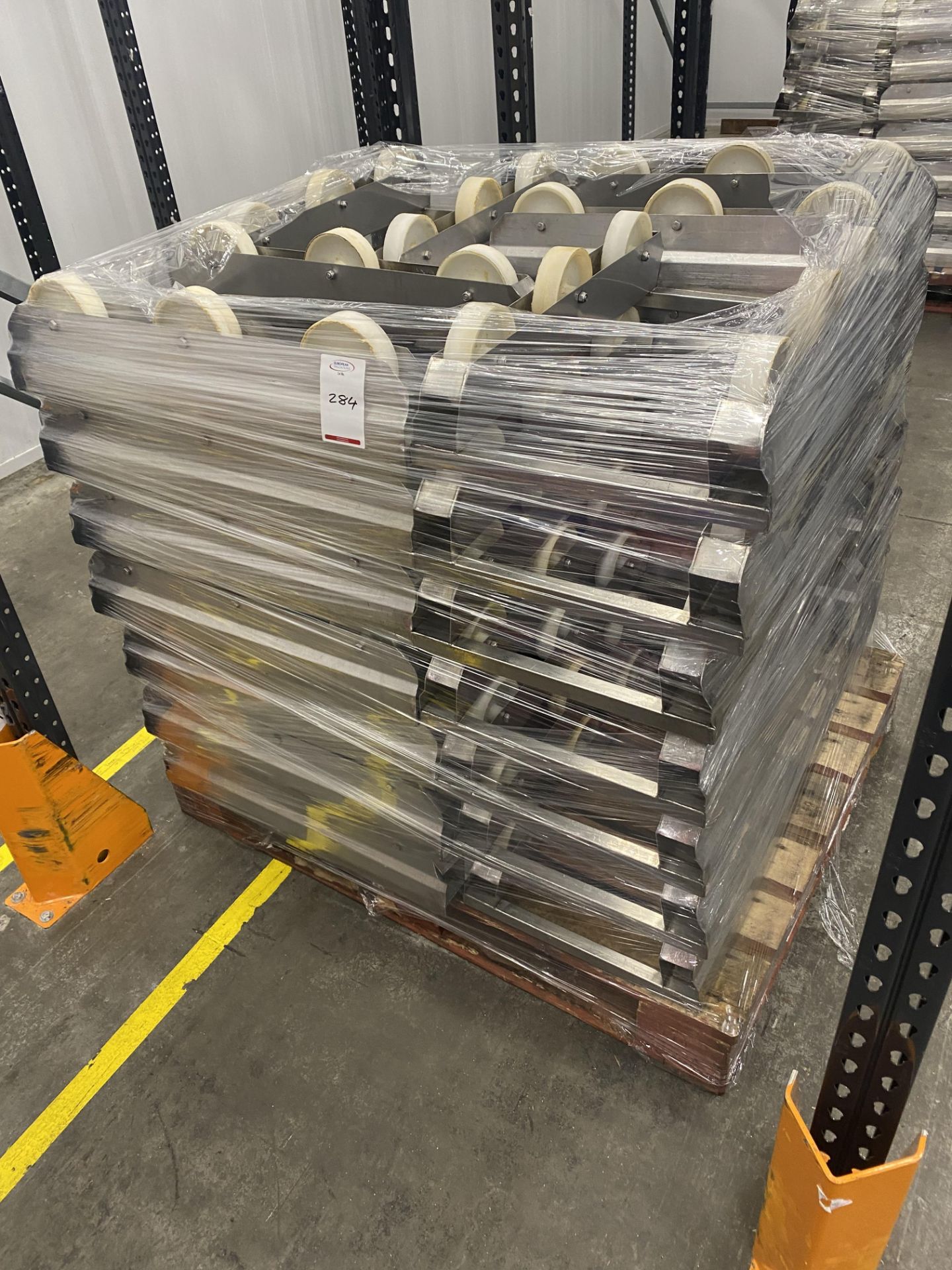 Pallet of stainless steel tray skids