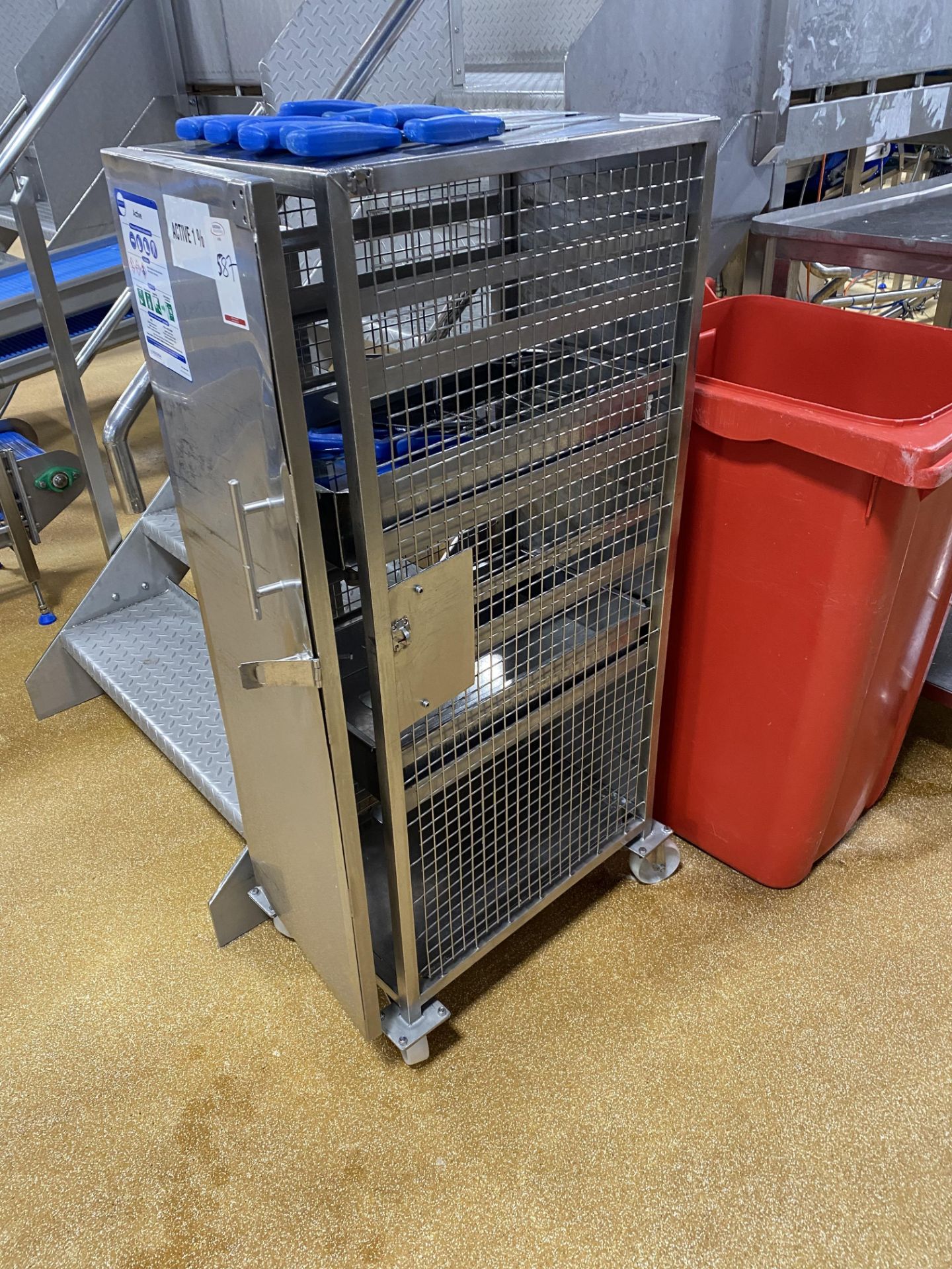 Mobile lockable stainless steel cage with the cont