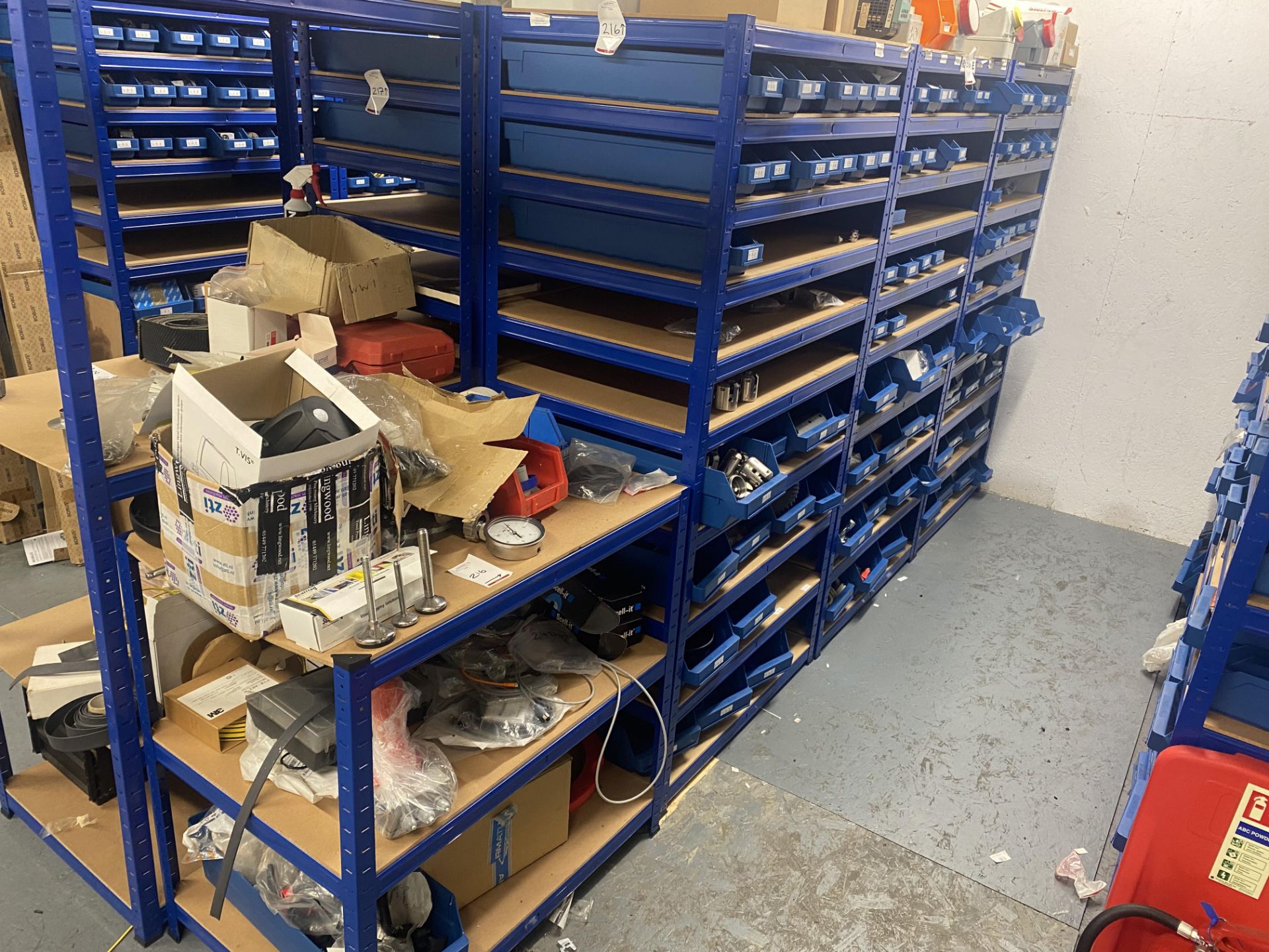 4 bays of racking and contents to include electric boxes , rubber rings and stainless steel