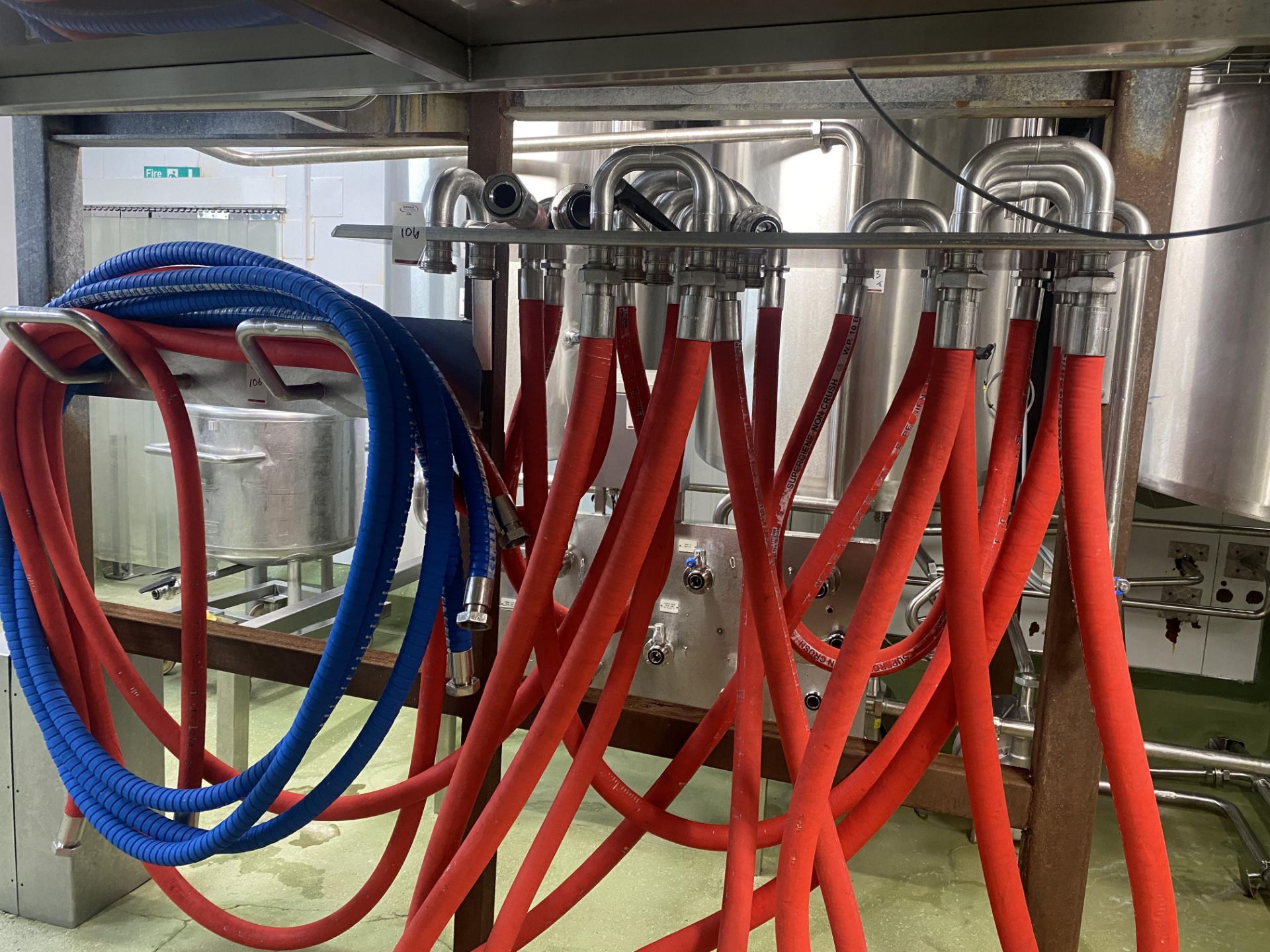 Purpose built stainless steel hose holder and various hoses as lotted