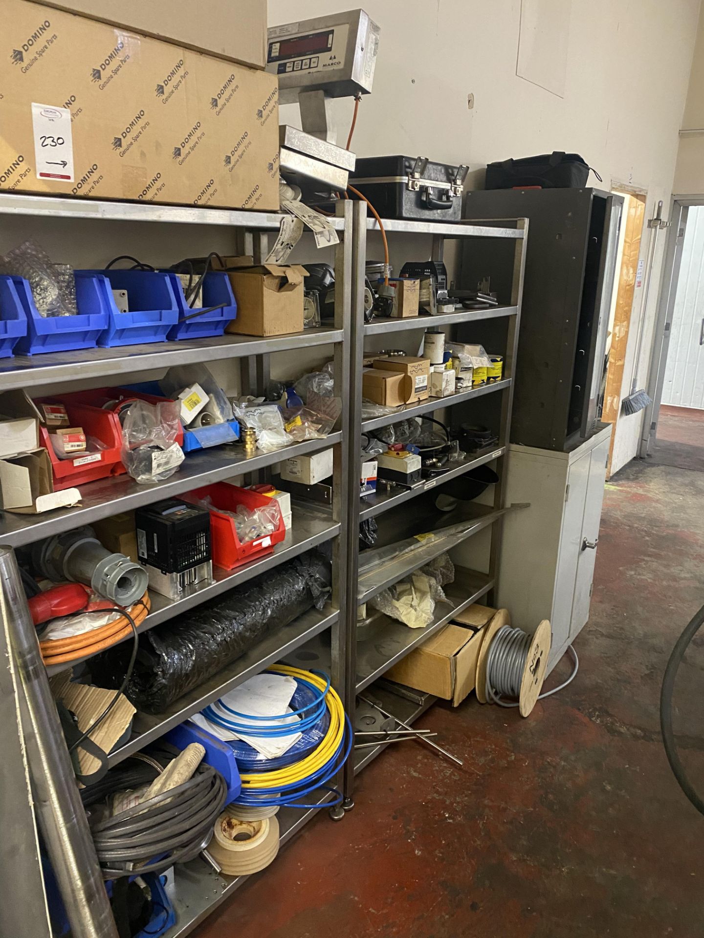 2 Stainless steel racks , 2 metal cabinets and contents of machine spares as lotted (located in