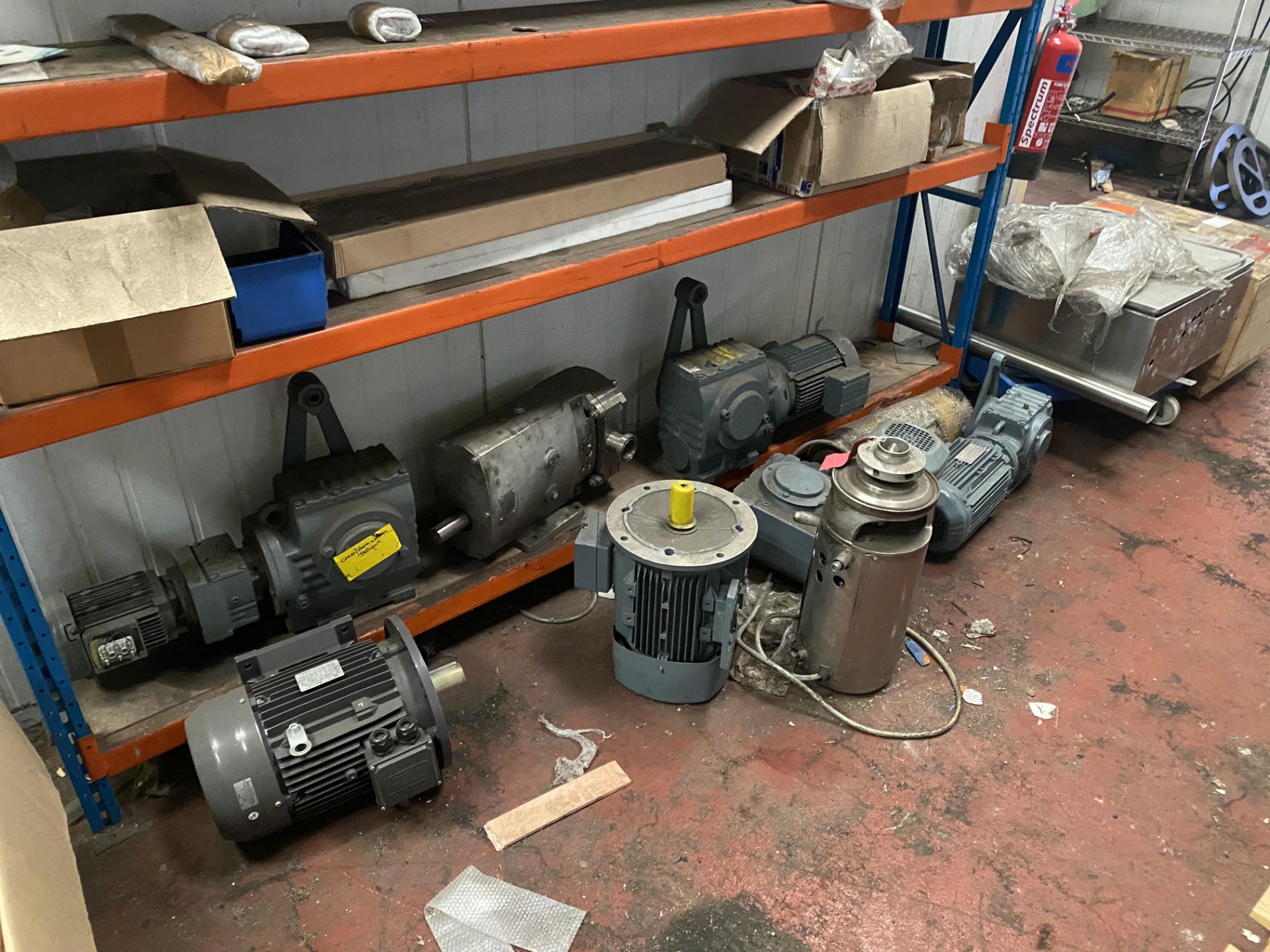 2 racks and contents to include a large quantity of motors and chiller parts as lotted