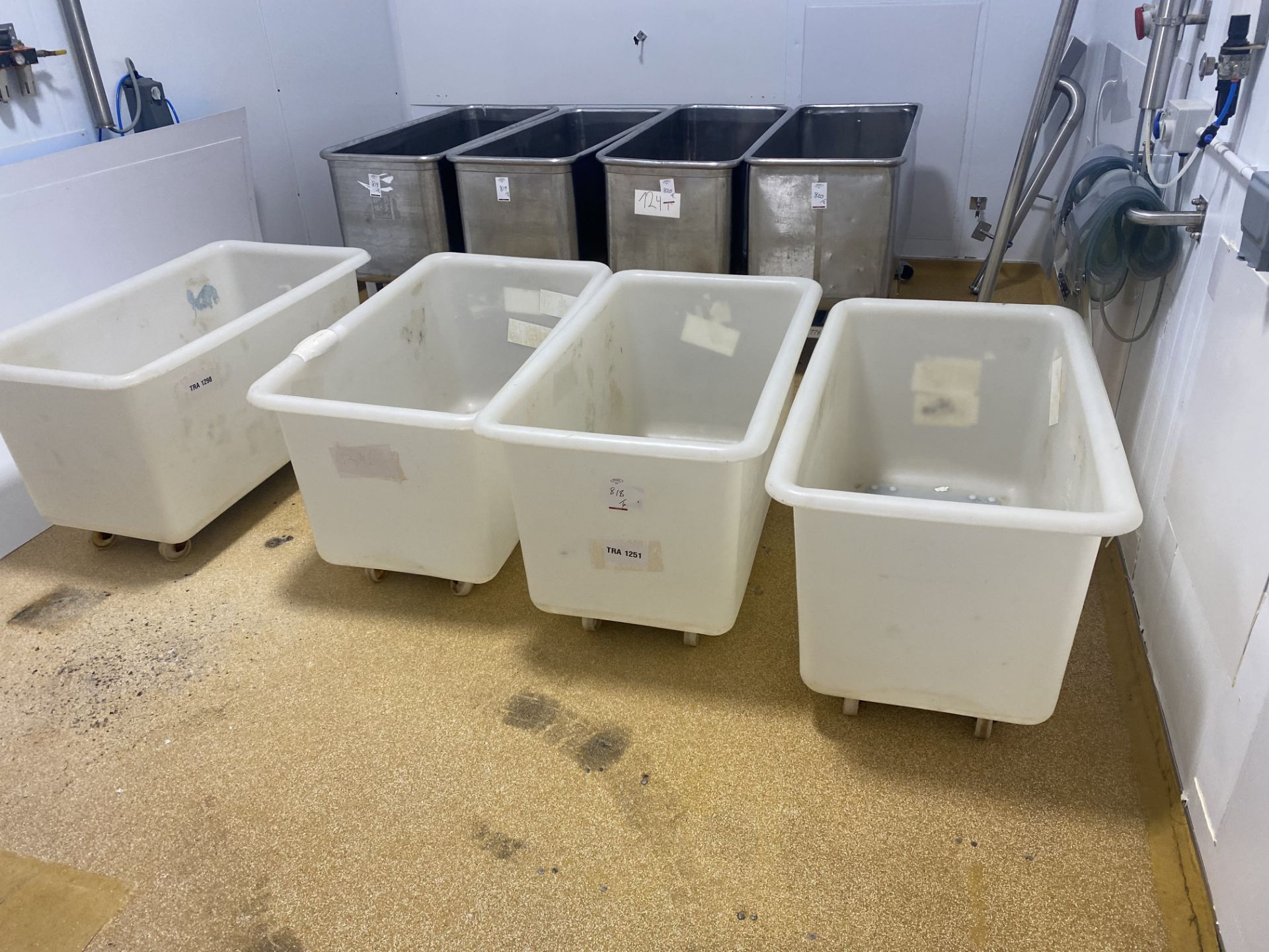 4 mobile plastic tubs