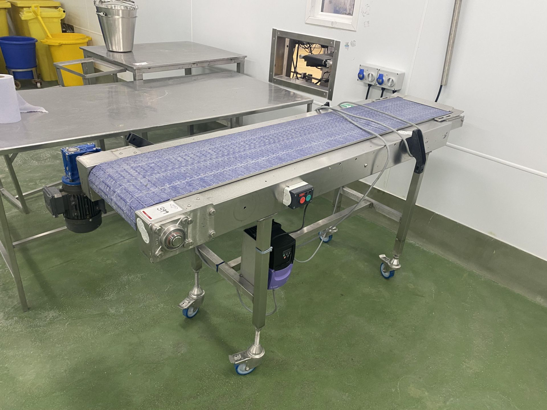 Mobile stainless steel motorised conveyor (located in Factory 5)