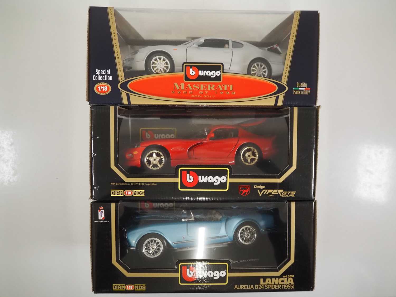 A group of 1:18 scale BBURAGO diecast cars to include Maserati, Dodge and Lancia examples - E in