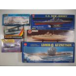 A group of unbuilt plastic kits of military ships and aircraft in various scales by AIRFIX, REVELL