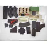 A quantity of TRI-ANG Minic Motorways track, controllers and buildings - G unboxed