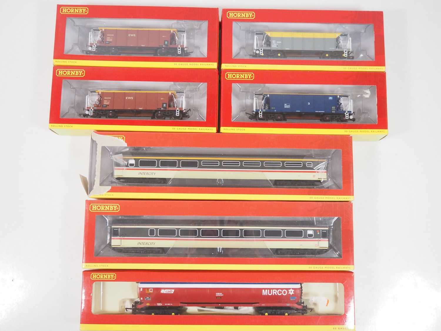 A group of HORNBY OO gauge rolling stock comprising various Seacow hopper wagons, a 100 ton tank