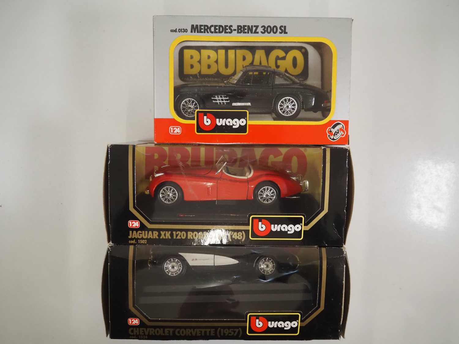 A group of 1:24 scale BBURAGO diecast cars to include Jaguar, Chevrolet and Mercedes Benz examples -