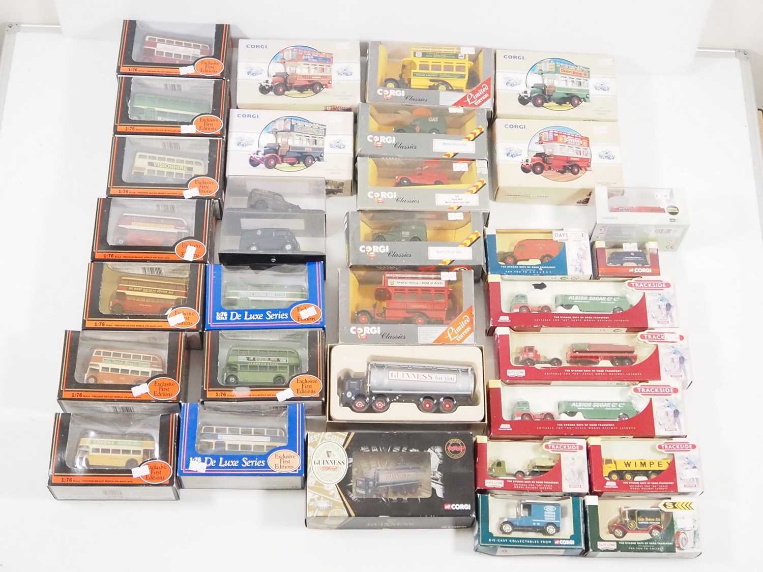 A group of 1:76 and 1:50 scale diecast vehicles, mostly buses and lorries, by EFE, CORGI and