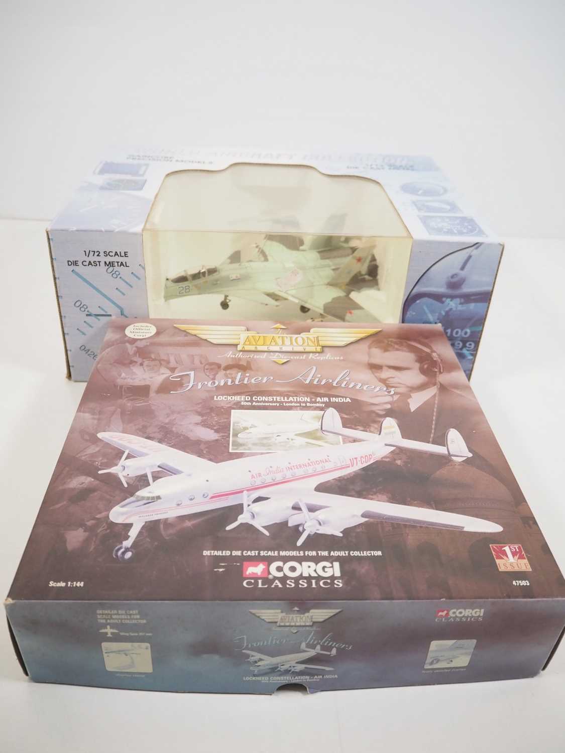 A pair of diecast model planes comprising a CORGI Aviation Archive 1:144 scale Lockheed