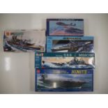 A group of unbuilt plastic kits of military ships and aircraft in various scales by AIRFIX, REVELL