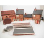 A group of G gauge or Gauge 1 low relief buildings and platforms constructed from plywood and