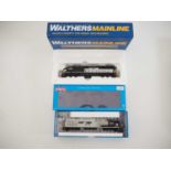 A pair of HO gauge American outline diesel locomotives by WALTHERS MAINLINE and ROUNDHOUSE both in