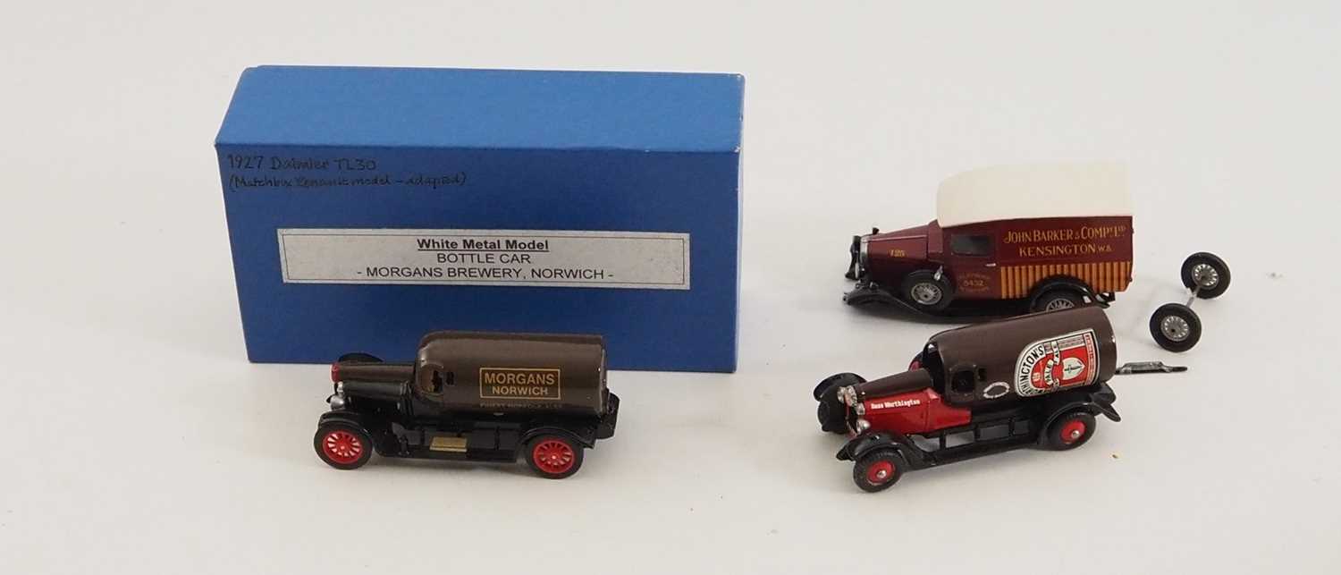 A group of whitemetal delivery vans comprising 2x brewery 'bottle' vans, and a 1935 Bedford van a/