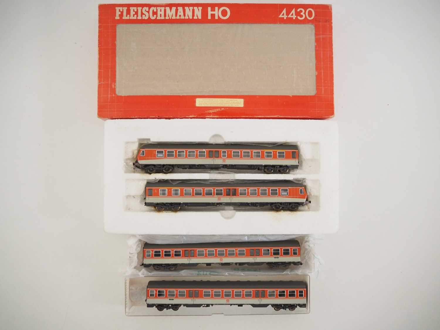 A FLEISCHMANN HO gauge 4431 German outline diesel multiple unit in DB orange/grey together with 2x