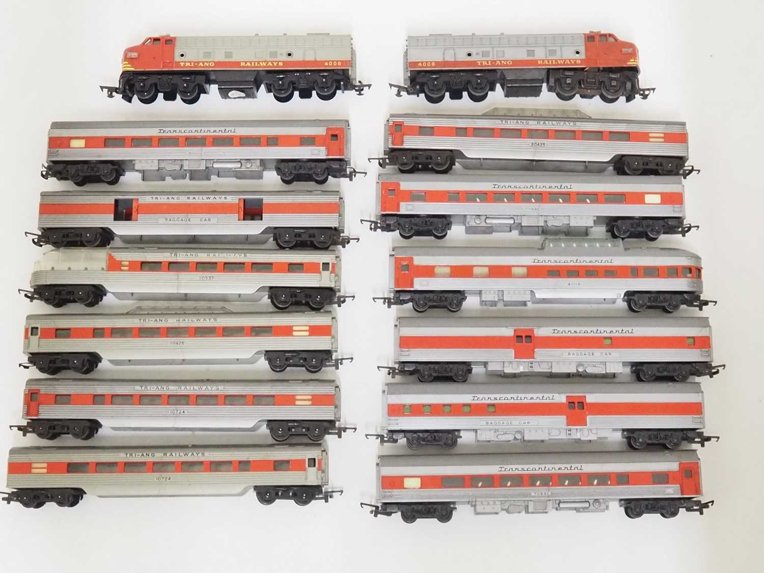 A group of TRI-ANG OO gauge unboxed transcontinental rolling stock including two diesel locos in