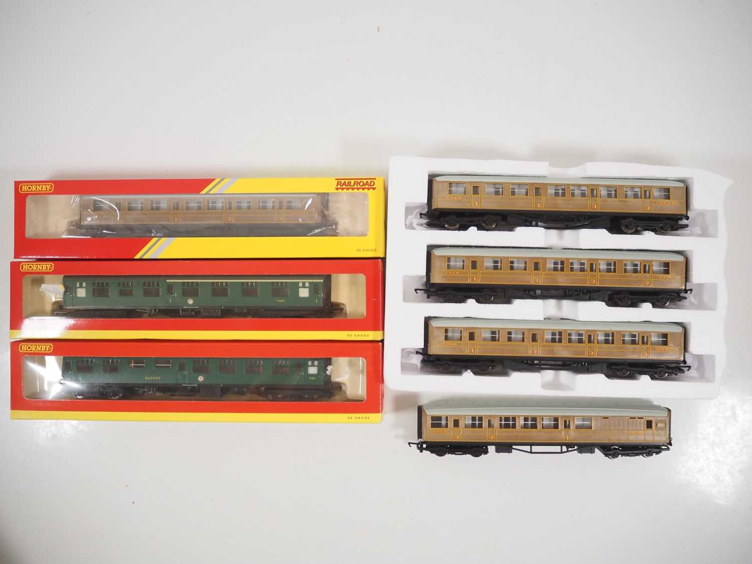 A group of HORNBY OO gauge passenger coaches in various liveries comprising 3x boxed examples, one