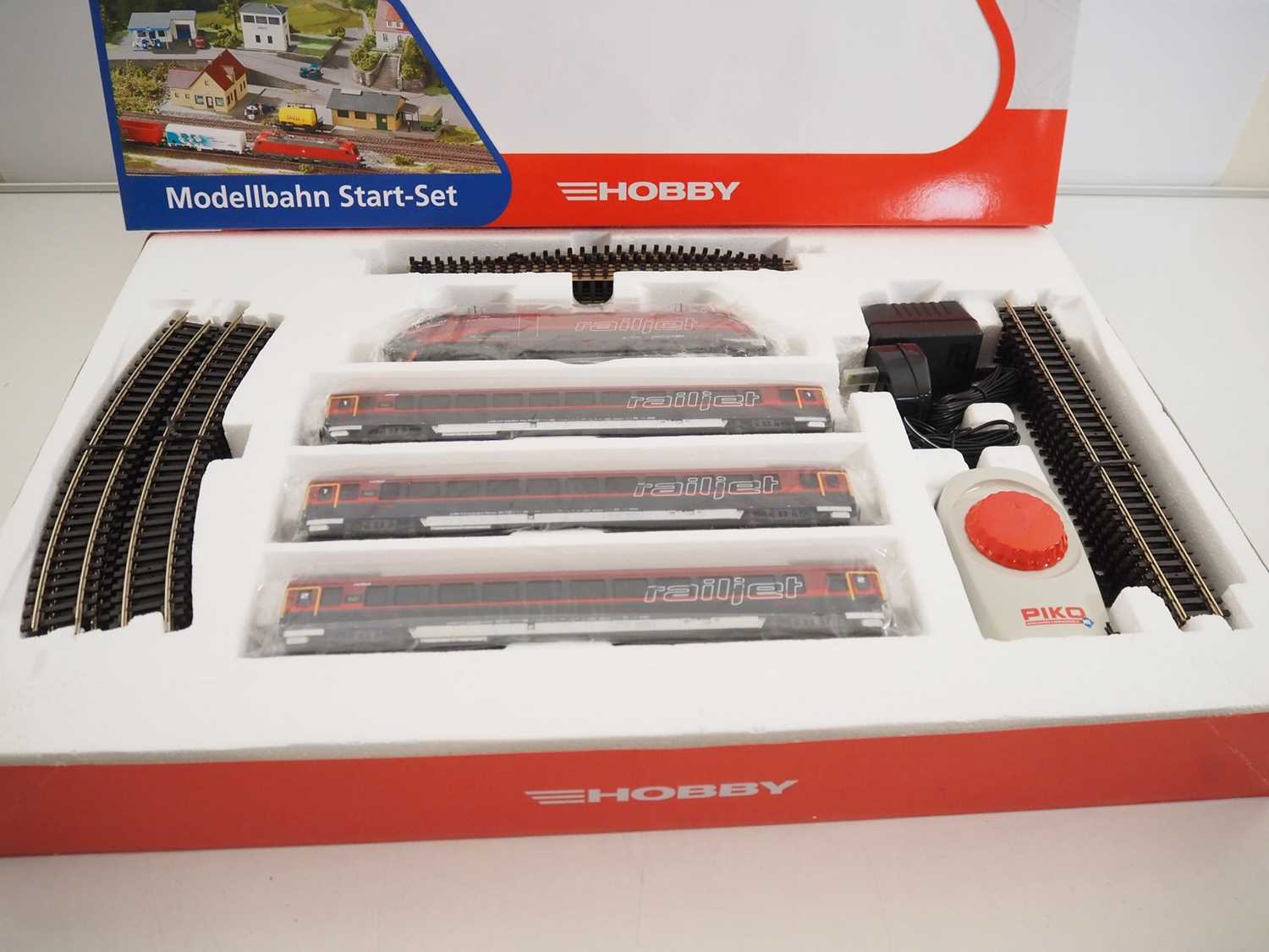 A PIKO HO gauge Austrian outline 57172 Railjet starter train set comprising a Taurus locomotive