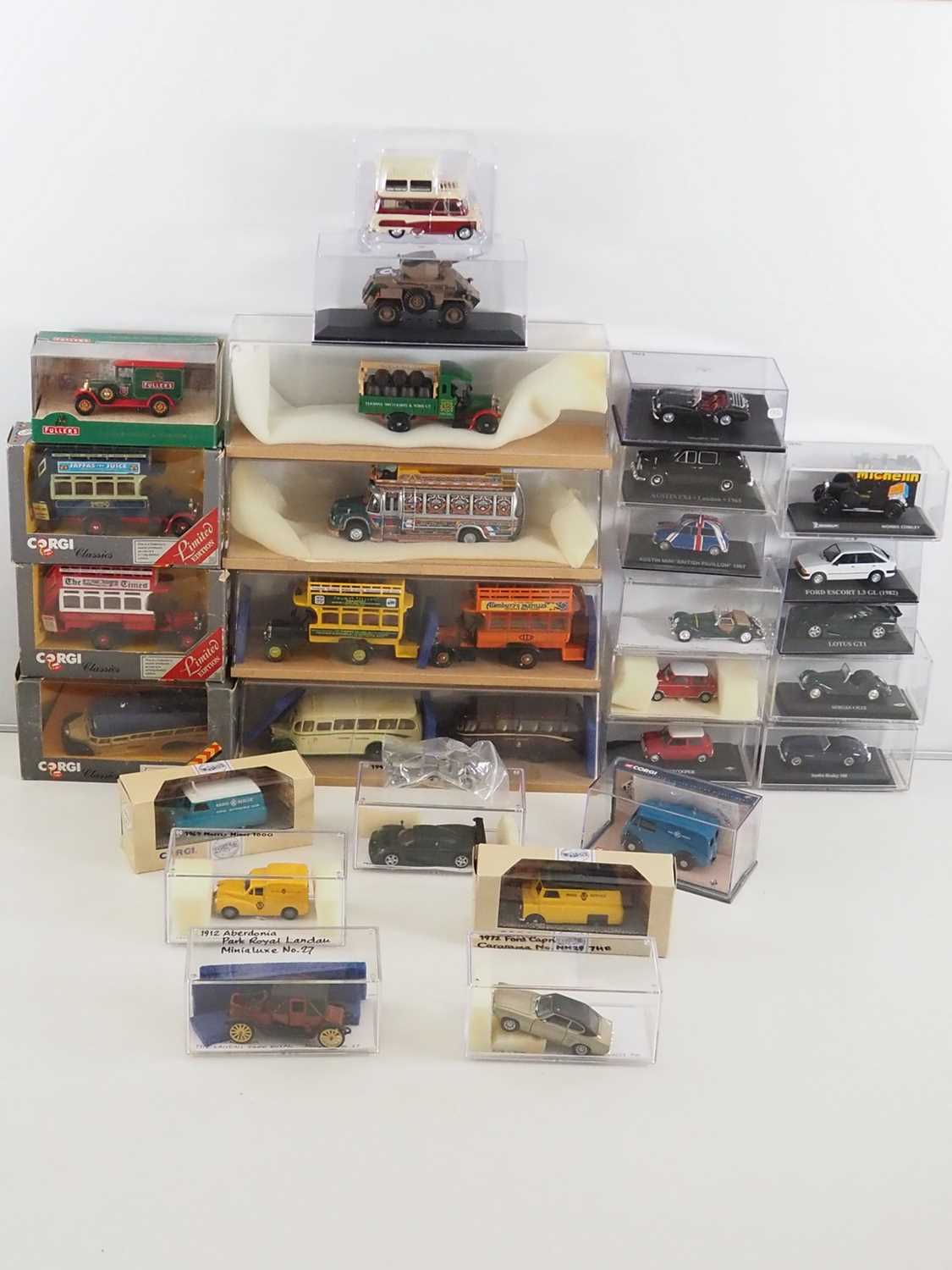 A quantity of mixed boxed and unboxed diecast by CORGI and others comprising buses, vans and