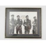 A framed and glazed 10" x 8" black/white still from WILD GEESE (1978) - signed and dedicated by