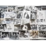 A large collection of mixed black/white film and publicity stills covering a wide range of films and