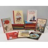 A large quantity of TINTIN: THE ADVENTURES OF TINTIN books comprising multiple copies - different