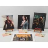 A group of signed colour photographs comprising THE MONUMENTS MEN display signed by Hugh Bonneville,